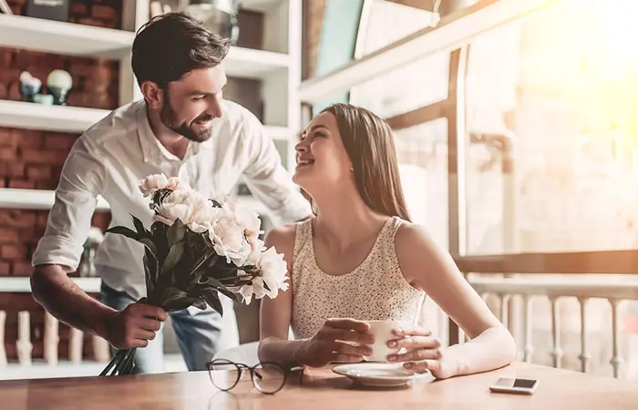 Man giving a bouquet to girlfriend 