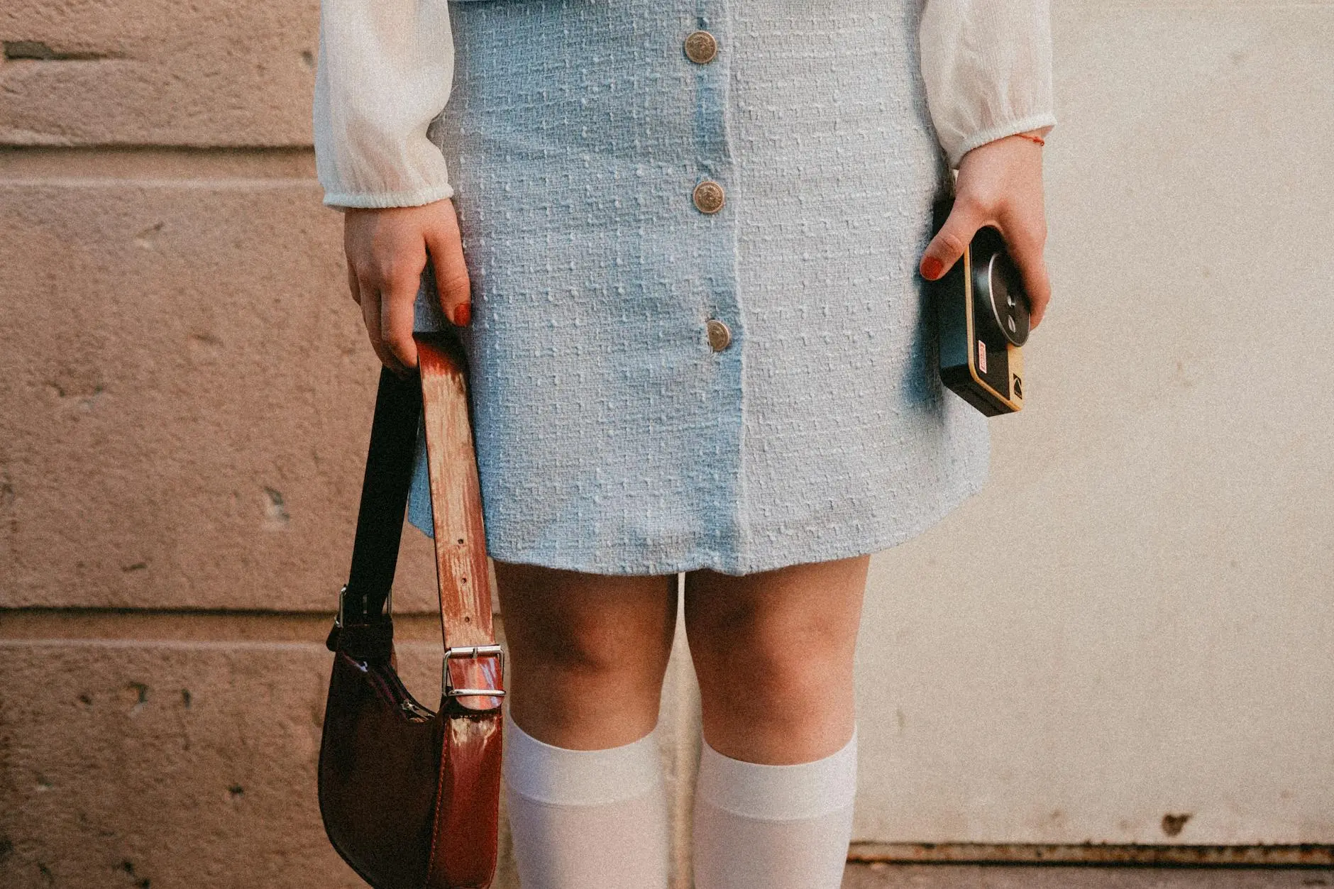 Y2K layering returns with sophisticated silhouettes and bold fabric pairings.