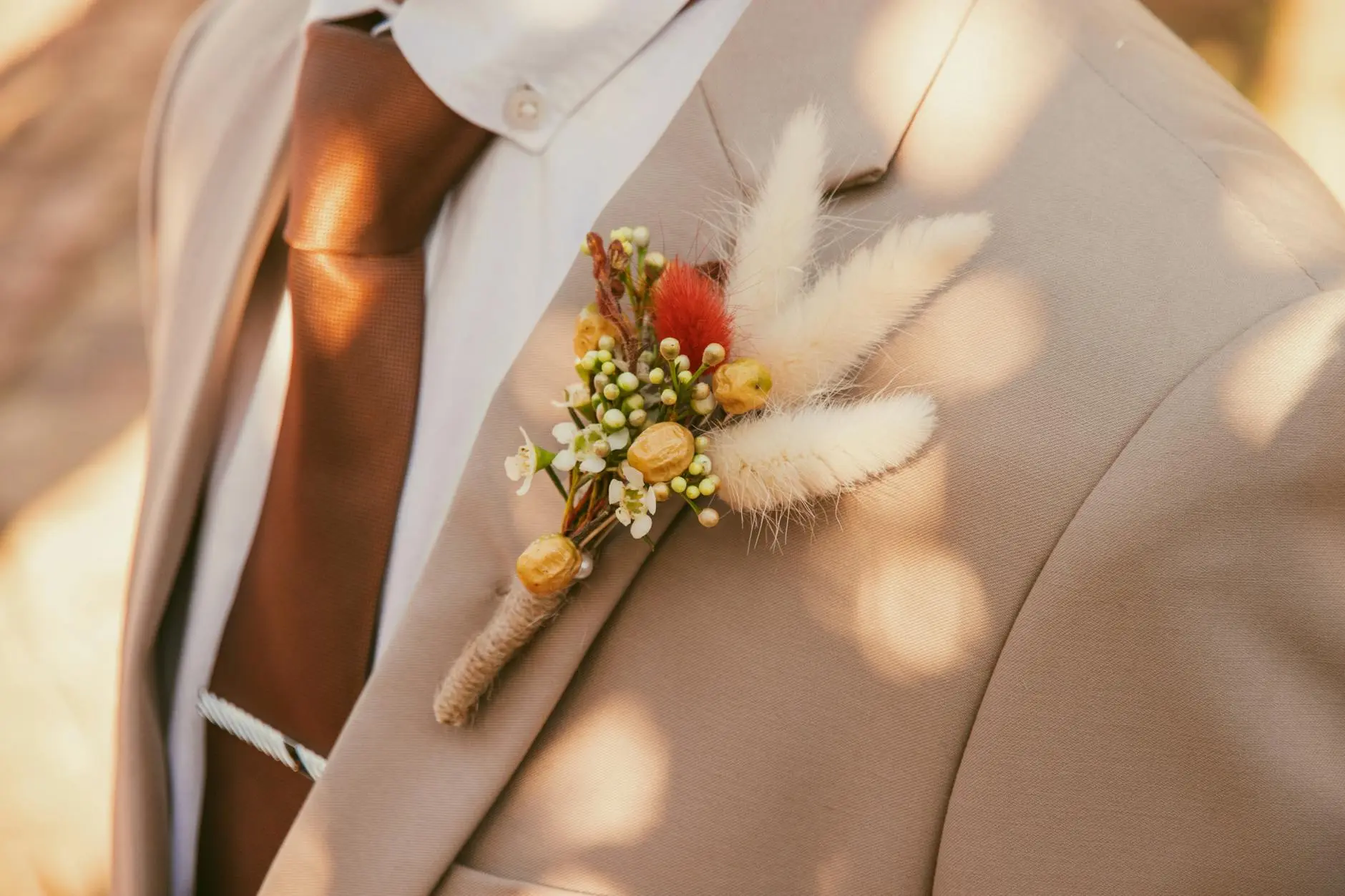Cozy jewel tones and earthy neutrals enhance every detail for a memorable celebration.